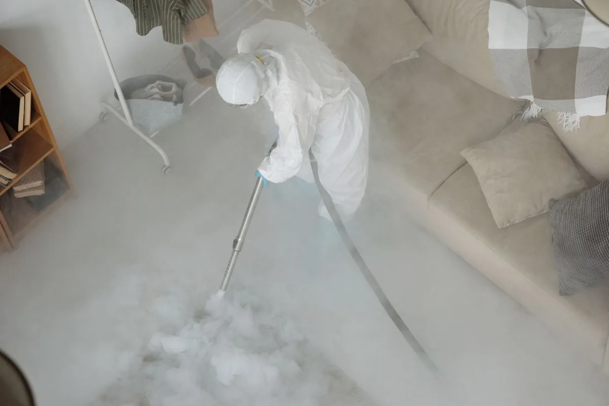 Biohazard cleanup technician in protective equipment, Parchment, MI